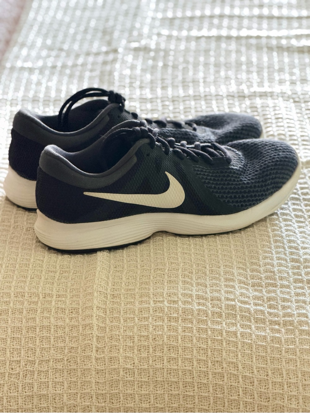 Nike women’s Black Running Shoes with White Swoosh